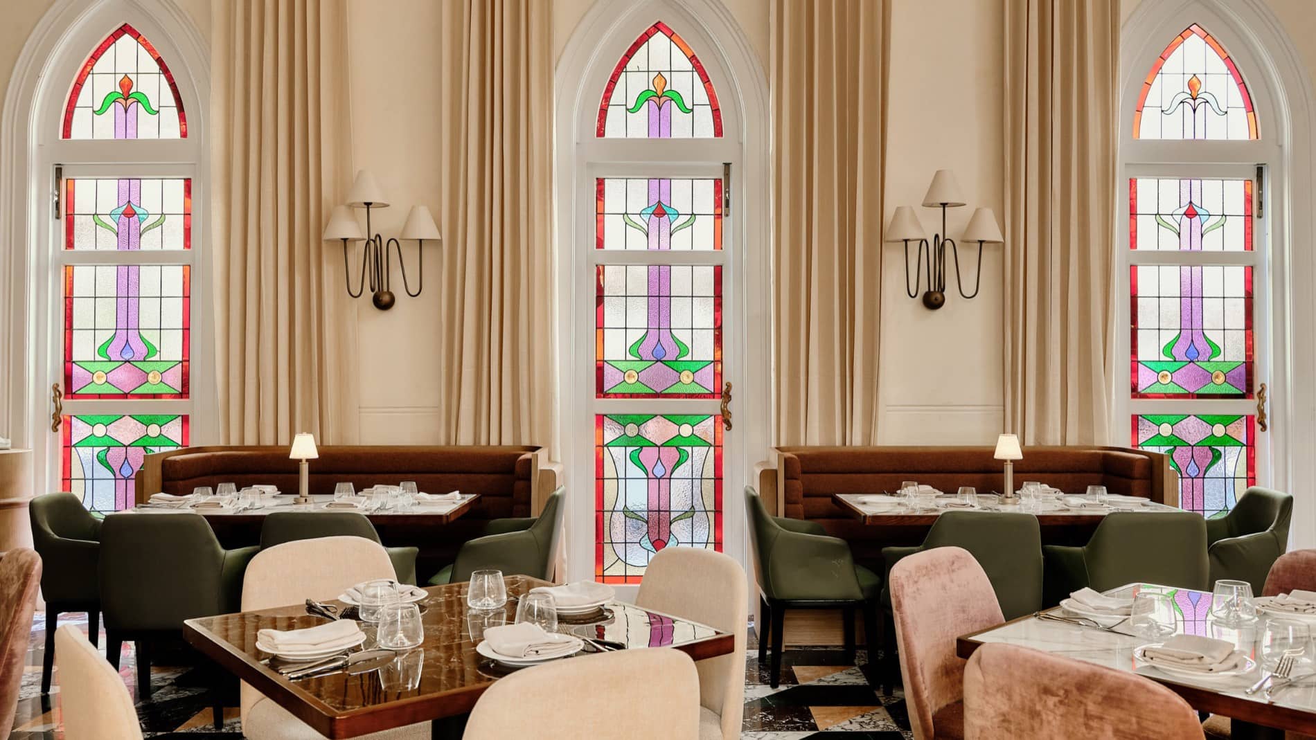 Stained-glass light falling across Aambra's interior